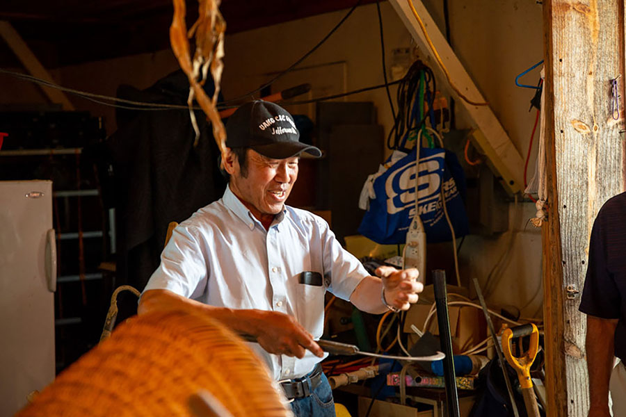 Cheu Vang of Vang C & C Farm Working With a Smile on His Face