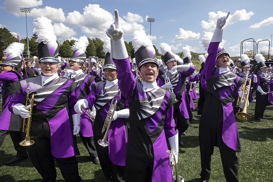 The Marching Band cheers while wearing their new uniforms.