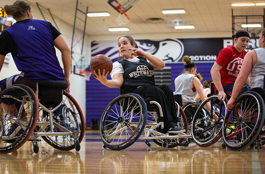 Becca Murray practices on a indoor basketball court.