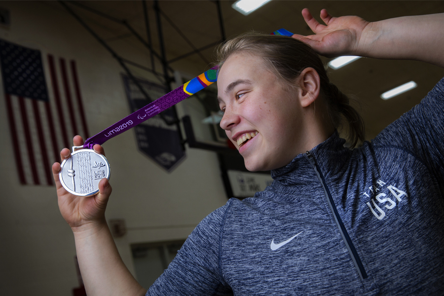 Lindsey Zurbrugg smiles and holds up her silver medal.