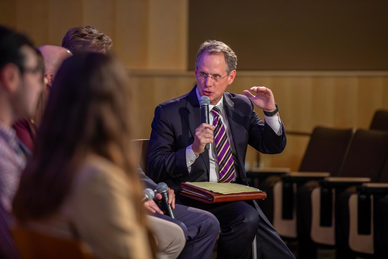 Mark Gmach talking with students