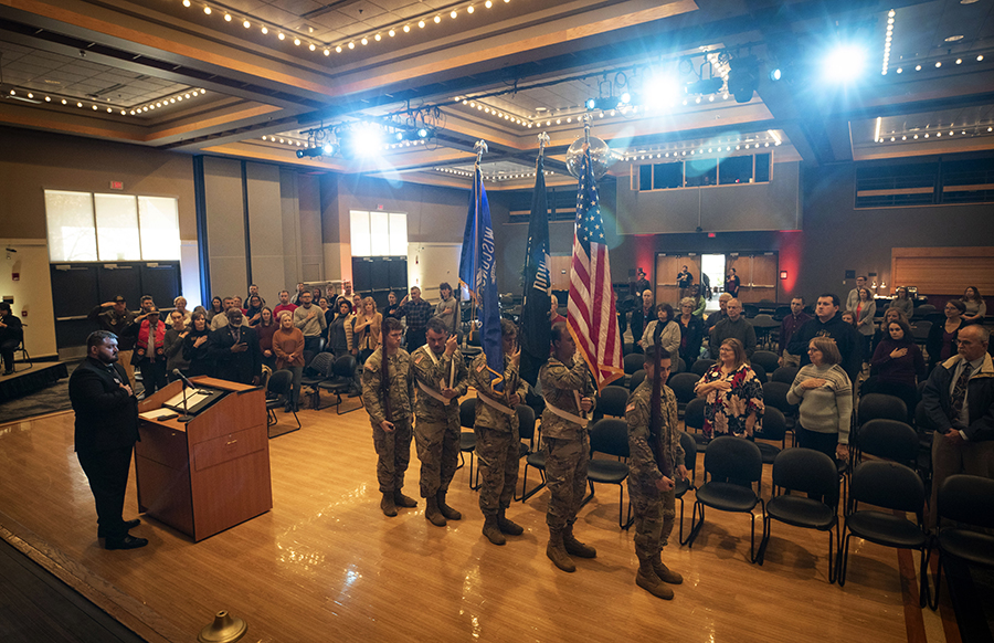 An ROTC color guard lines up in the University Center.