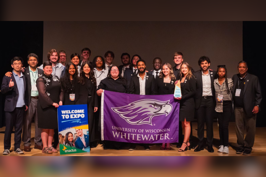 Photo of the Enactus group with Warhawk Flag.