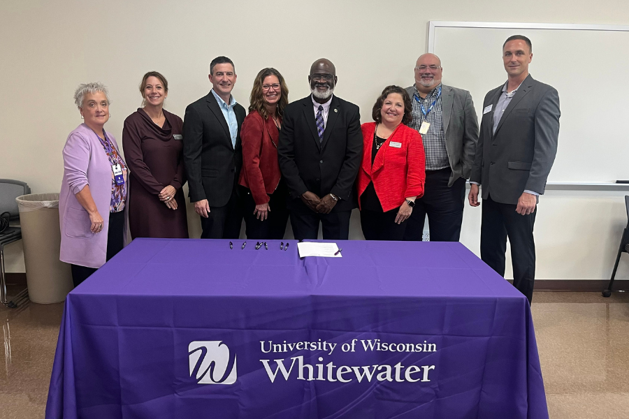 Photo of the Chancellor with several other staff.