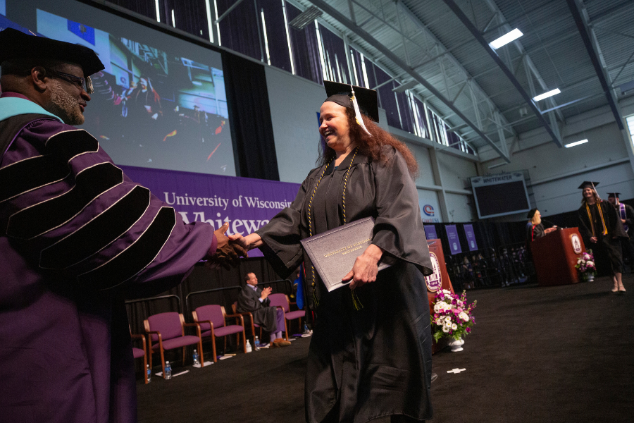 Photo of student graduating.