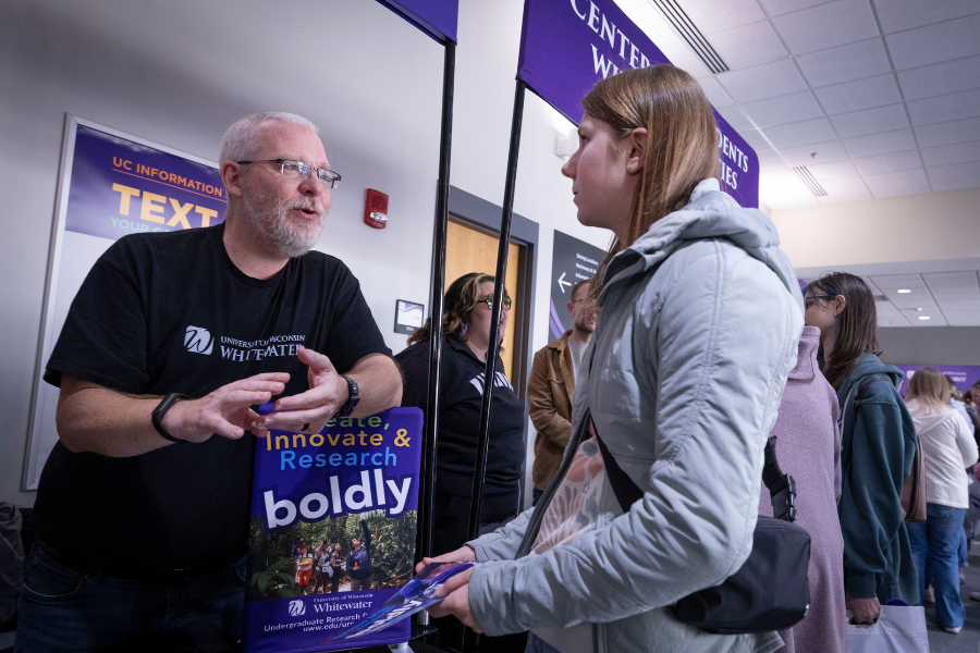 John Frye speaks to a student.