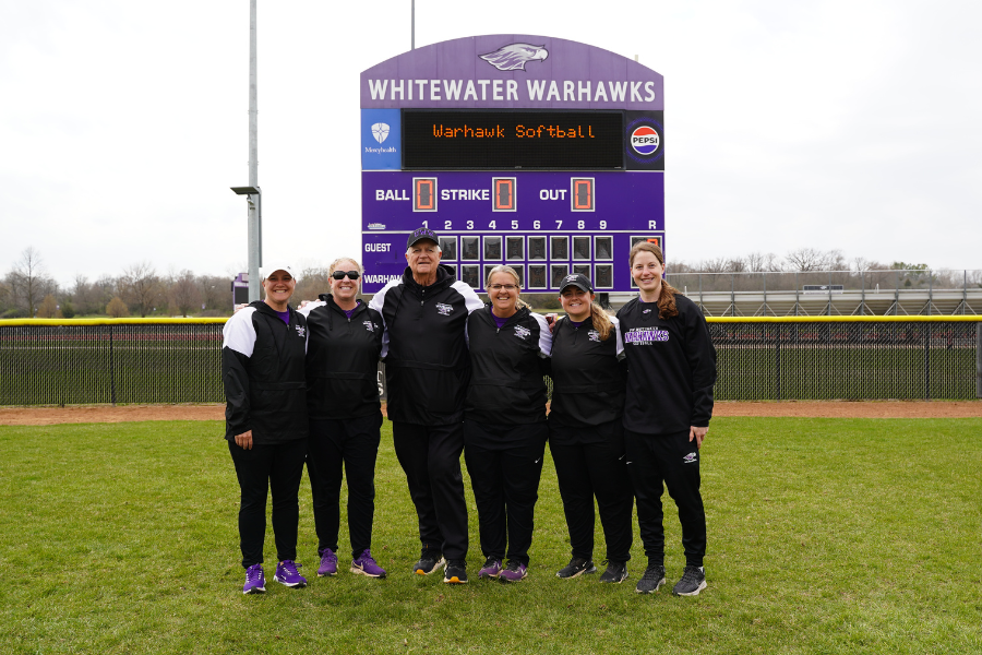 Head coach Brenda Volk, fourth from left, is joined by her coaching and support staff in 2025. Assistant coaches Beth Bonuso, second from left, and Steve Evans, third from left, have each been on Volk&rsquo;s staff for 25 or more years. (UW-Whitewater athletics photo)