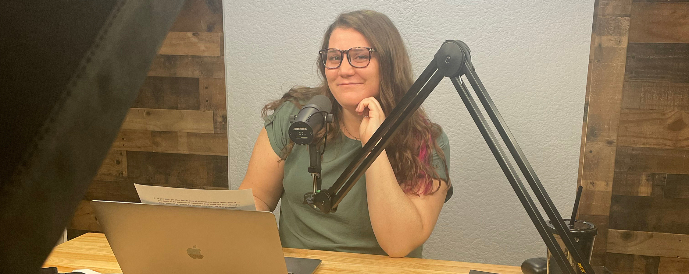 Photo of Monica and a mic on the side.