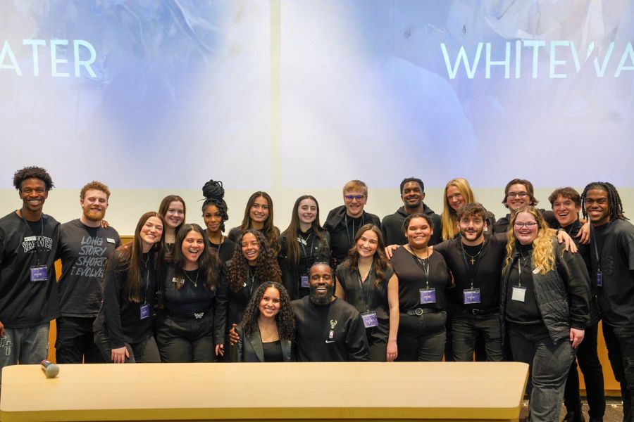 Students pose for photo afer an Evolve meeting. 