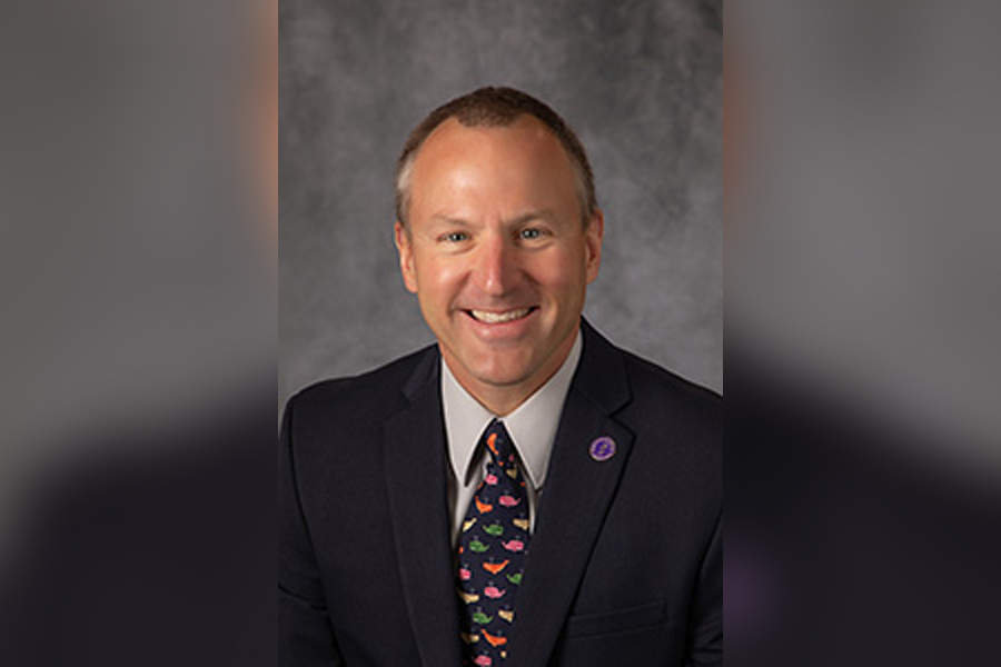 Pieter deHart wearing a dark suit and tie.