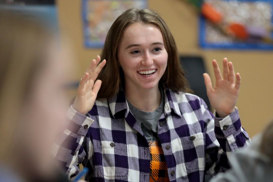 Sabrina Wolf speaks in a classroom. 