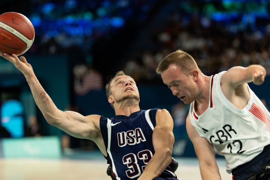 Photo of John about to shoot basketball.