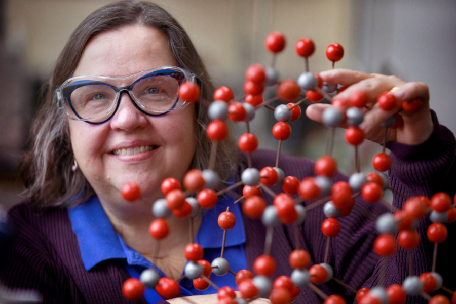 Kimberly Kostka shows a molecular model.