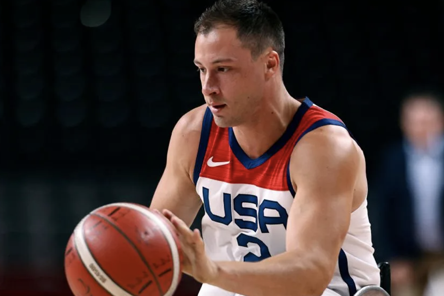 uww coach jake williams playing wheelchair basketball