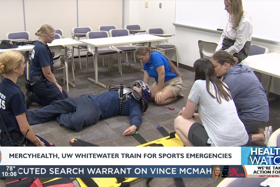 people practice CPR in a classroom