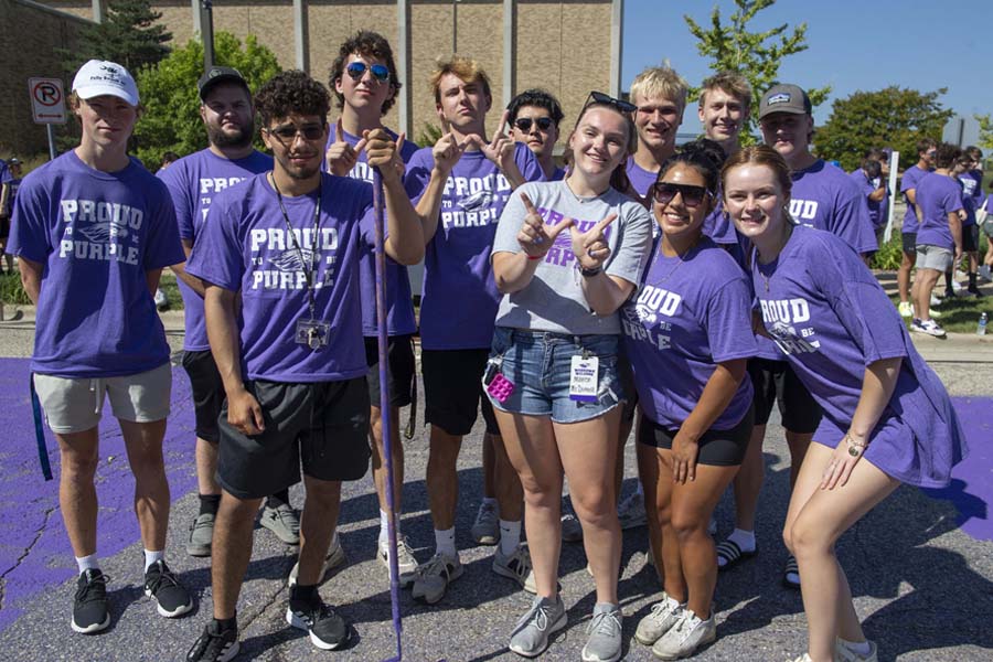 students posing in purple