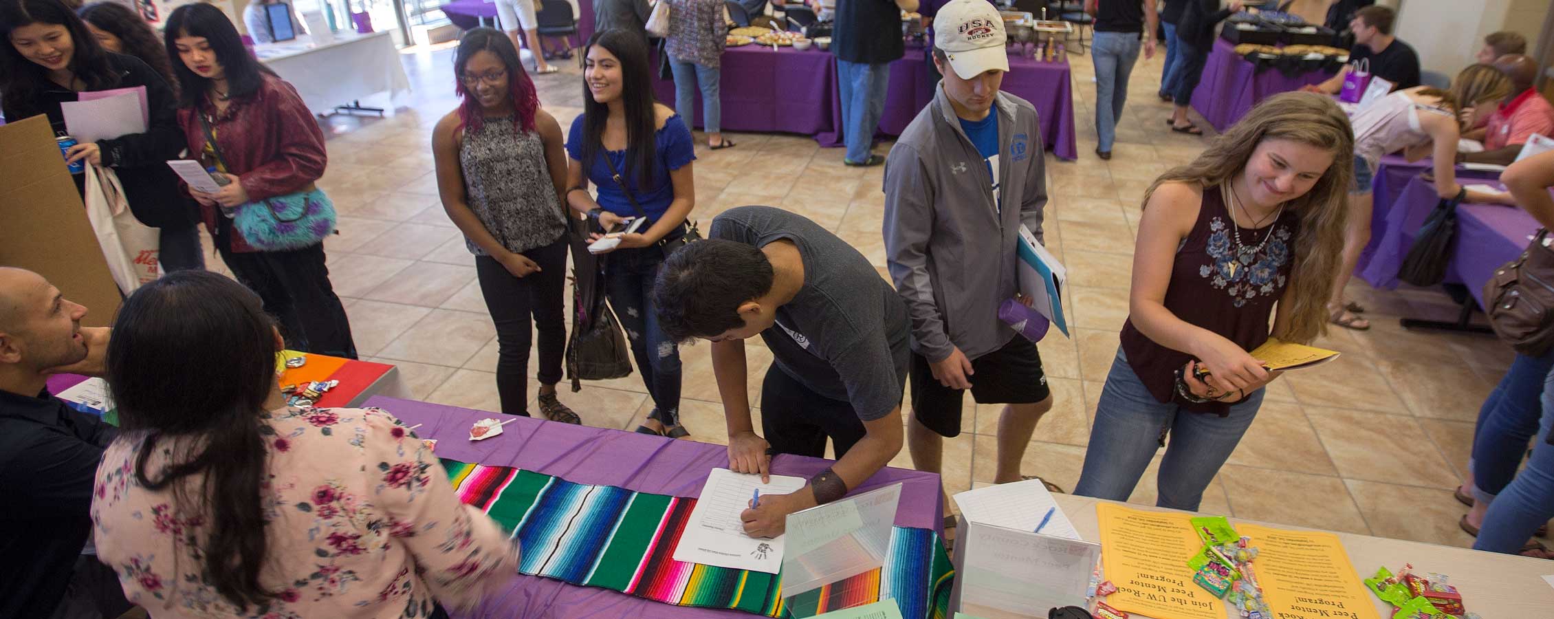 people attending a fair at UW-Rock County