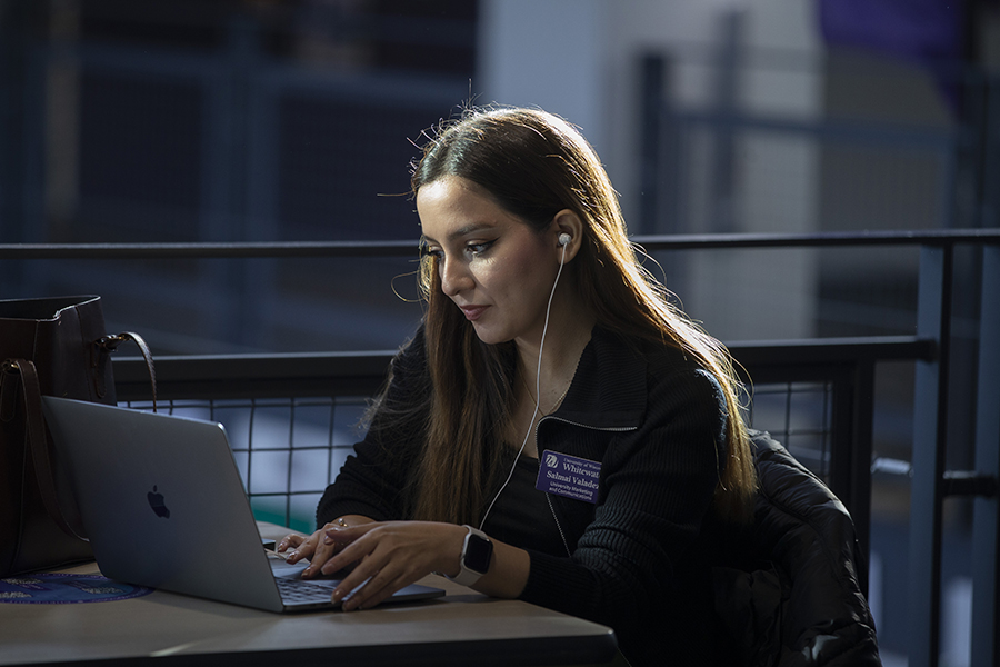 A person works on a laptop.