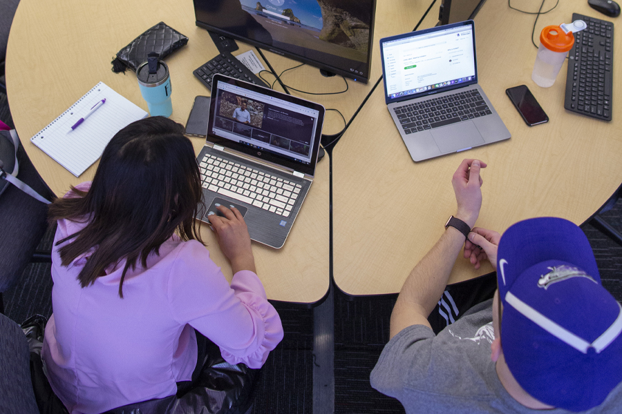 An overhead view of people sitting at computer stations.